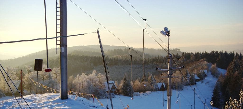 The snow-covered piste and lifts at the Kohútka ski area in the Javorníky